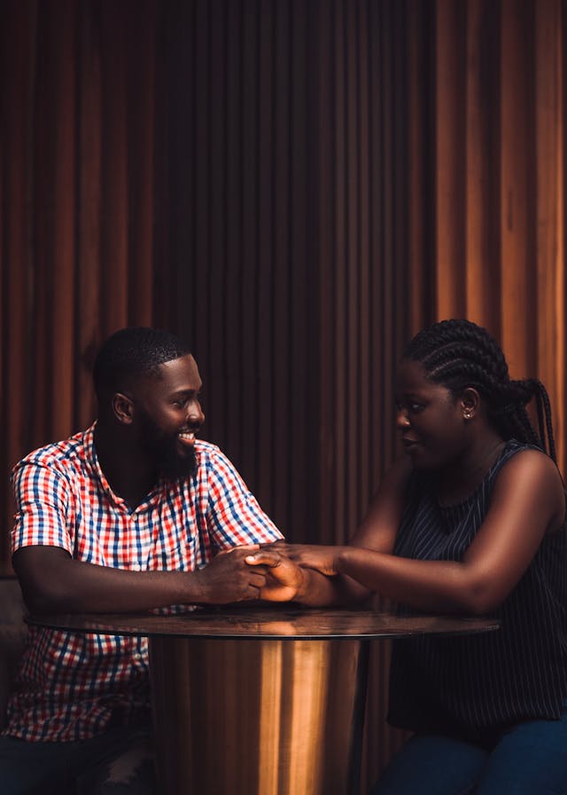 Couple's Conversation A husband and wife clasping hands as they stand and talk together