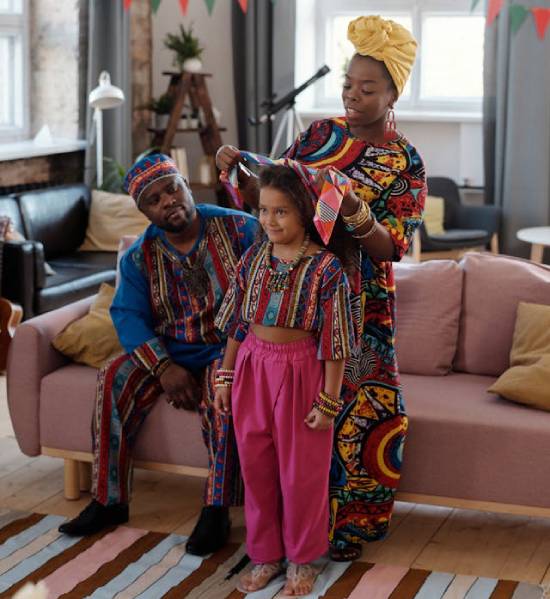 A married African woman spending time with her husband and daughter.