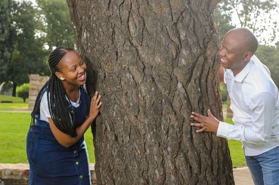 A couple spending quality time in a park to unwind and bond as a way of achieving emotional and psychological wellbeing.