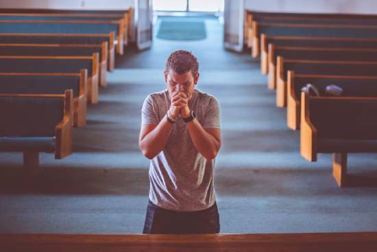 A man praying to reconnect with God and feel His presence in his life.
