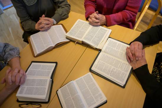 A christian Bible study group discussing what the Bible says about money and worry.