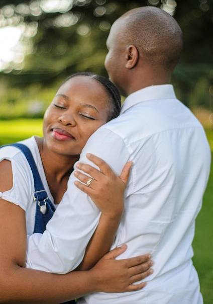 Couple Hugging in the Park A couple hugging in the park after spending time together solving their marital conflicts.