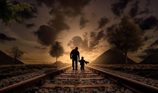 A father and son walking on the railway sharing stories about values to embrace in life.