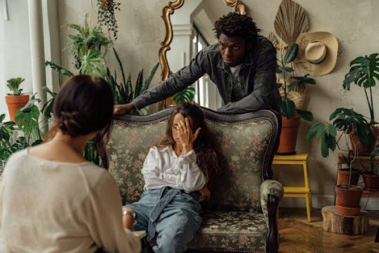 A Christian Counsellor Attending to a Couple A Christain counsellor attending to a depressed couple.