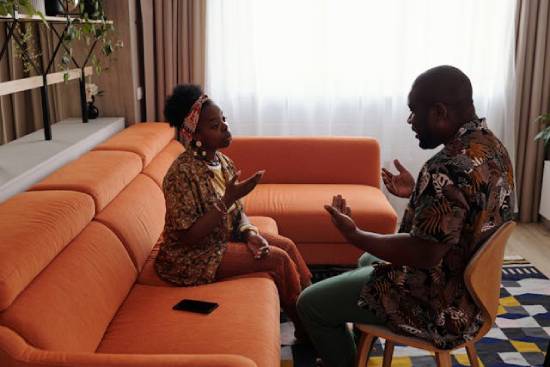 A couple having a safe conversation to help them resolve their conflict.