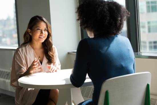 Career Coaching A young woman who has been frustrated at work seeking career coaching to help her deal with challenges better.