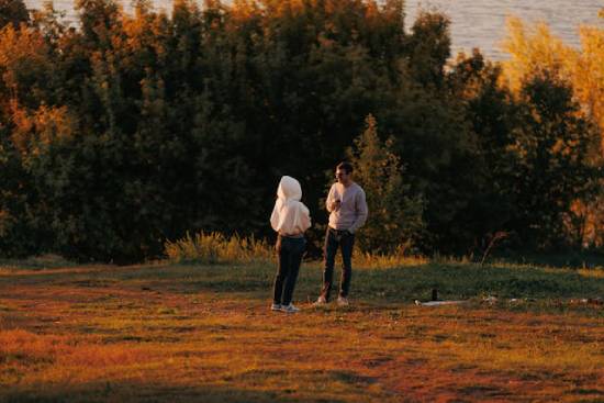 A Couple Enjoying a Sunset Talk A couple enjoying a fall evening outdoors at sunset.