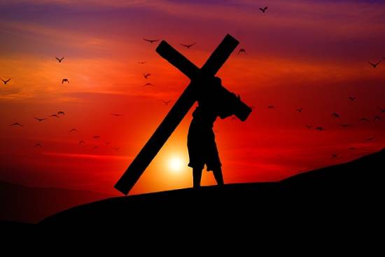 Jesus Christ Carrying the Cross A silhouette of Jesus Christ Carrying the cross to Calvary.