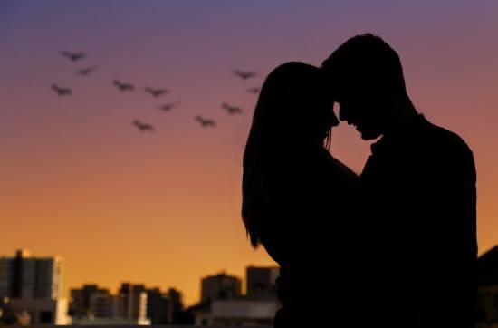 Silhouette of a Couple During the Golden Hour A silhouette photo of a couple embracing during the golden hour.