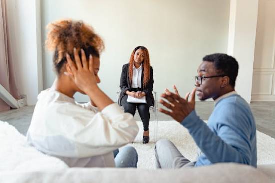 A Couple Arguing at a Psychotherapist's A quarrelling couple seeking the services of a professional psychotherapist.