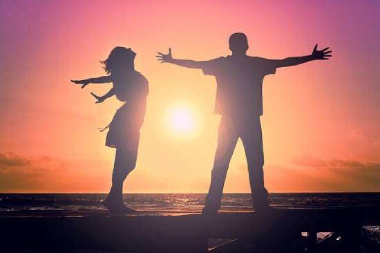 Lovers Ready to Hug Silhouette of young lovers with open arms ready for a big hug.