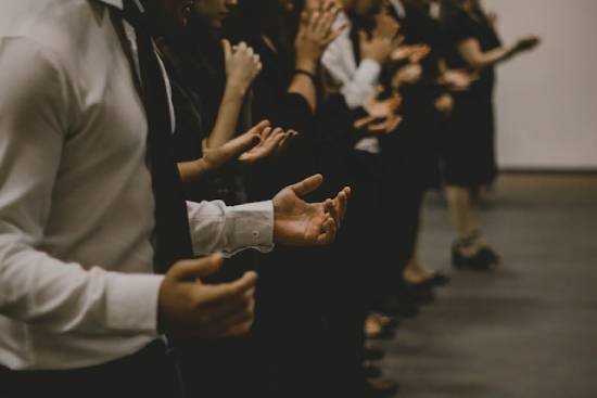 Faithfuls Worshipping God A group of faithfuls praising and worshipping God with hands lifted.