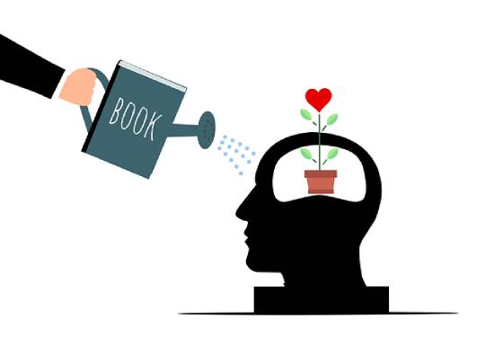 Self-care and Mentalhealth An illustration of self-care and mental health with a hand holding a book and pouring information into one's mind.