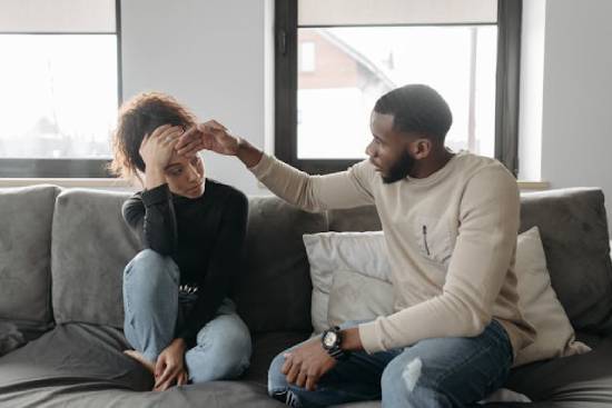 A depressed woman visiting a psychotherapist.