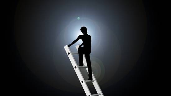 A Person Climbing a Ladder Silhouette of a person climbing the ladder against fear and regret.